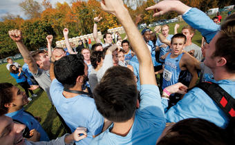 Columbia’s men’s cross country team and its supporters celebrate the Lions’ Ivy/Heps win at Van Cortlandt Park. Photo: Gene Boyars